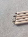 A set of five wooden dotted tools comes with different tip sizes best for lippan art